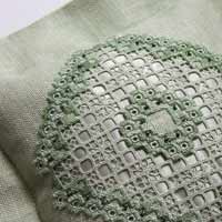 Hardanger embroidery cushion in soft greens with silk and beads